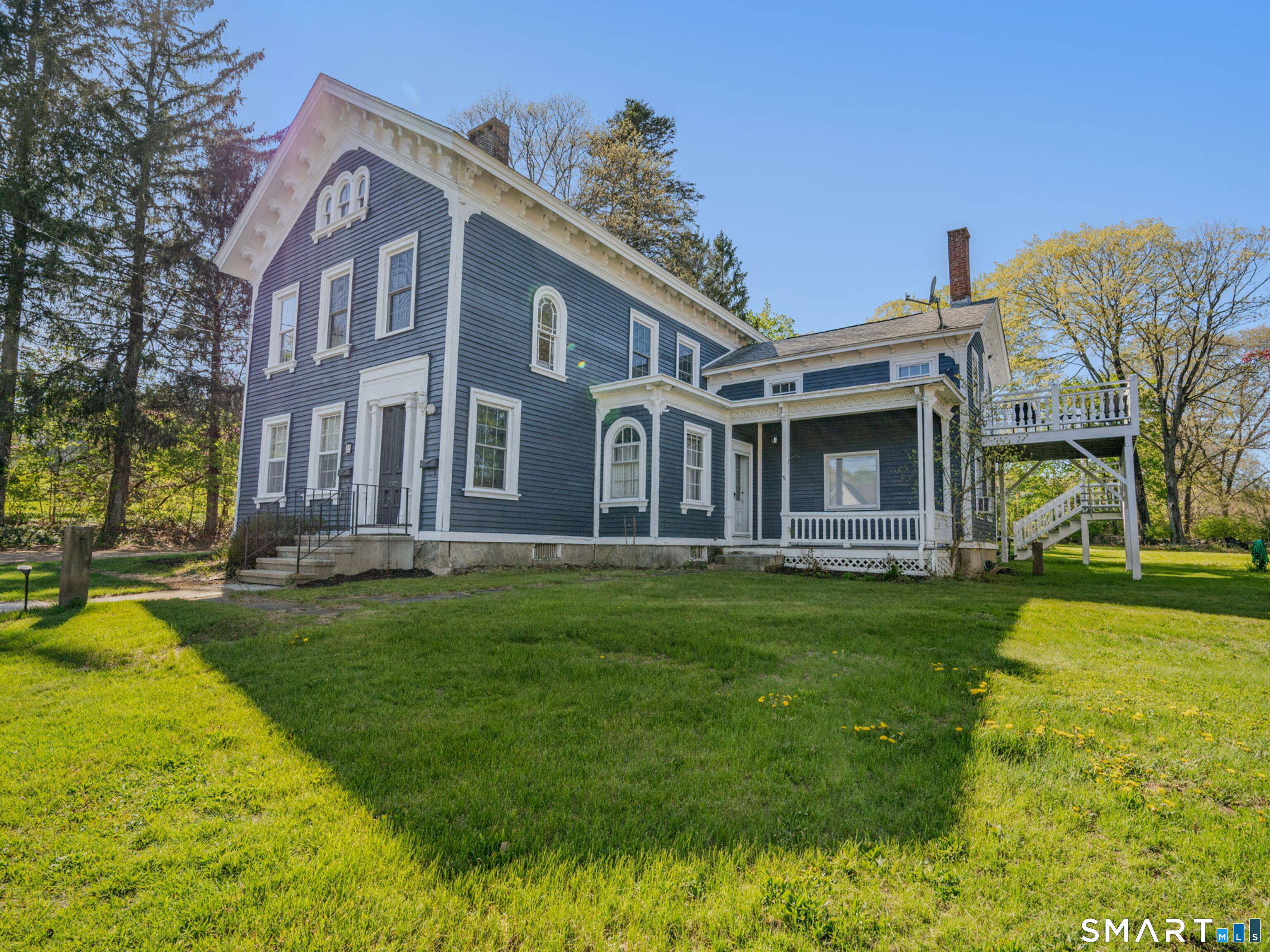 22 West High Street East Hampton, CT 06424 - Photo 37 of 40 a view of a house with a yard porch and sitting area