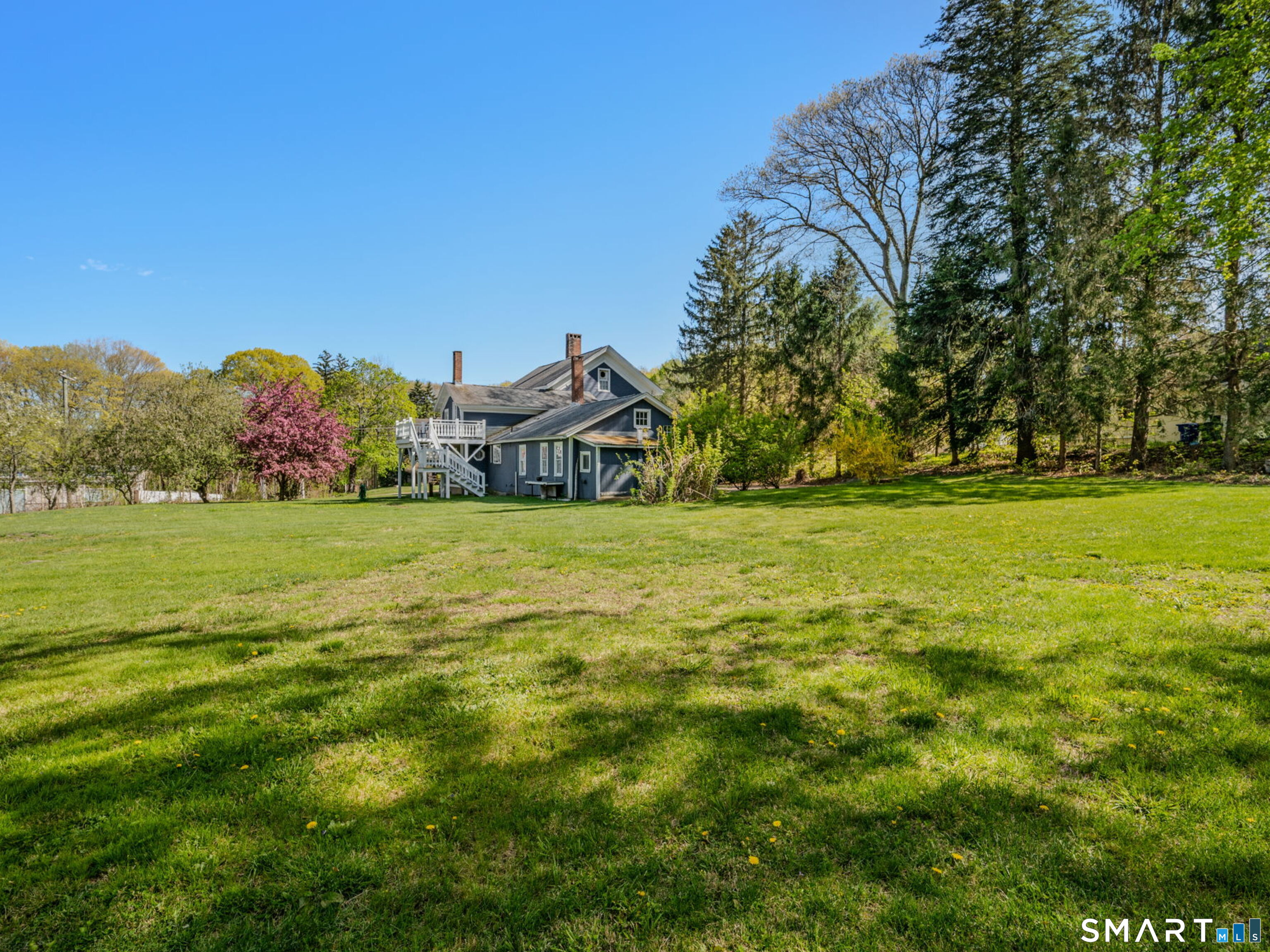 22 West High Street East Hampton, CT 06424 - Photo 4 of 40 a view of a field with an trees in the background