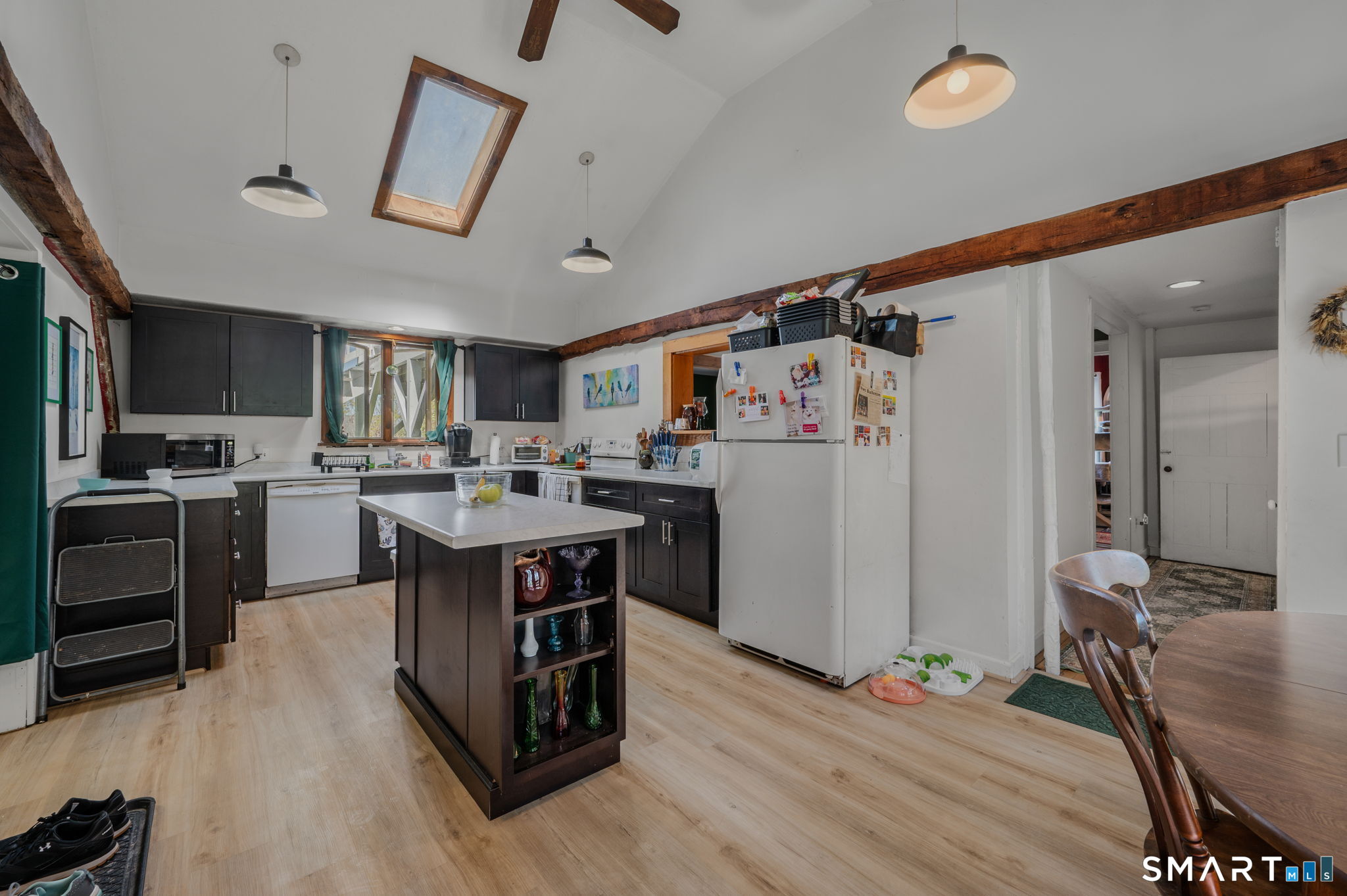 22 West High Street East Hampton, CT 06424 - Photo 8 of 40 a kitchen with stainless steel appliances granite countertop a refrigerator a stove a sink dishwasher and a refrigerator with wooden floor