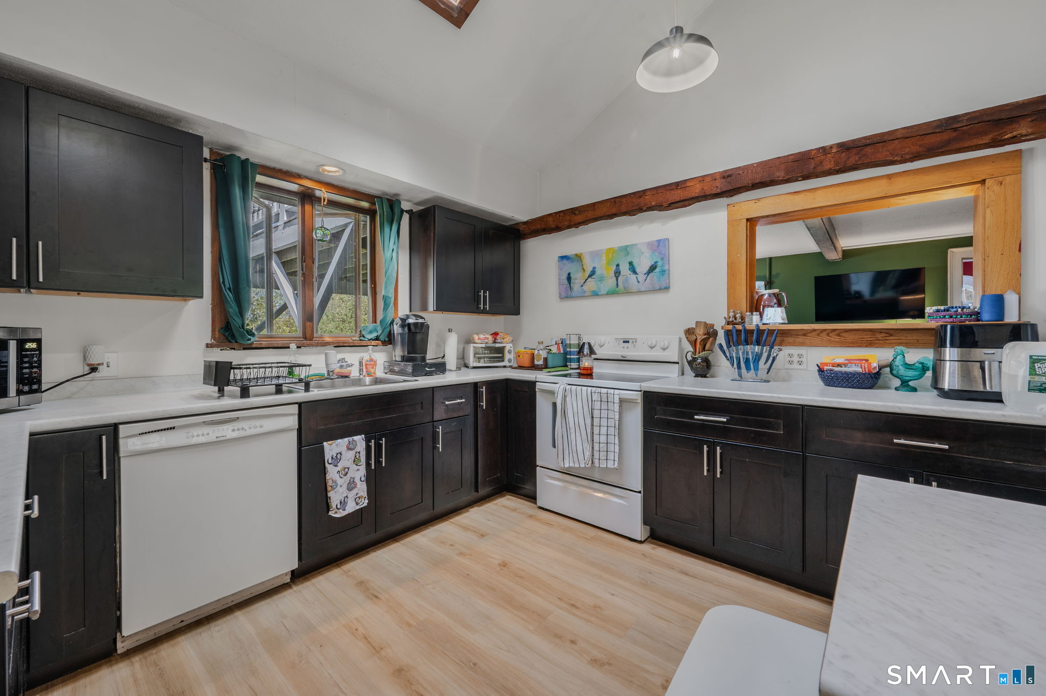 22 West High Street East Hampton, CT 06424 - Photo 9 of 40 a kitchen with a sink cabinets and window