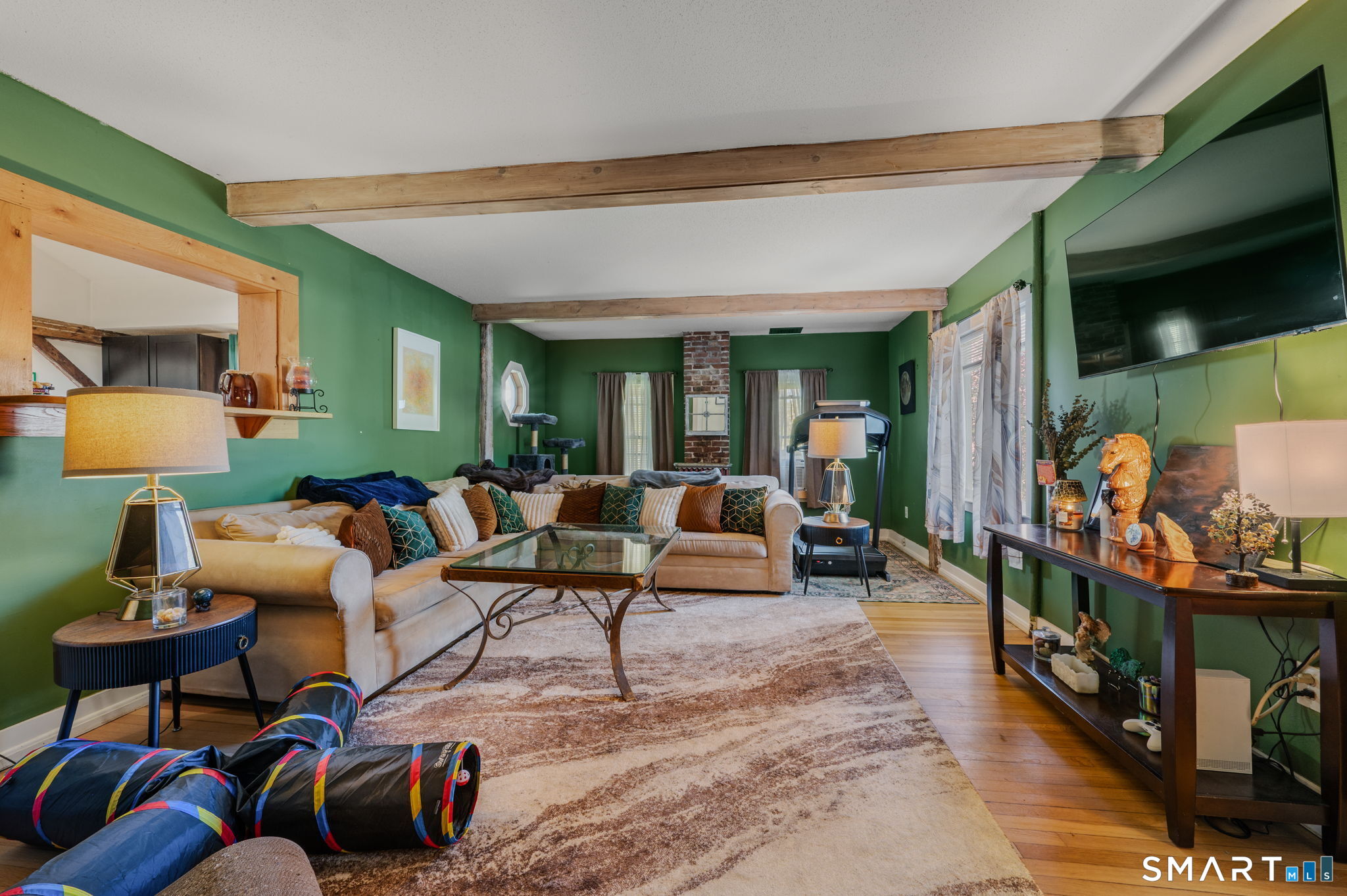22 West High Street East Hampton, CT 06424 - Photo 10 of 40 a living room with lots of furniture and a flat screen tv