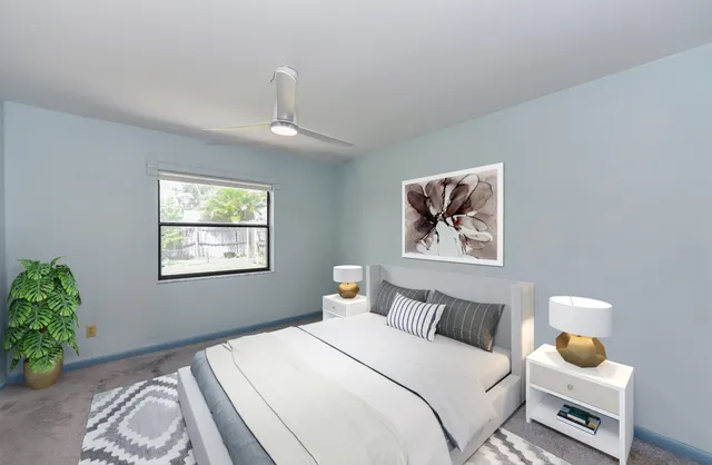 a bedroom with bed and a window