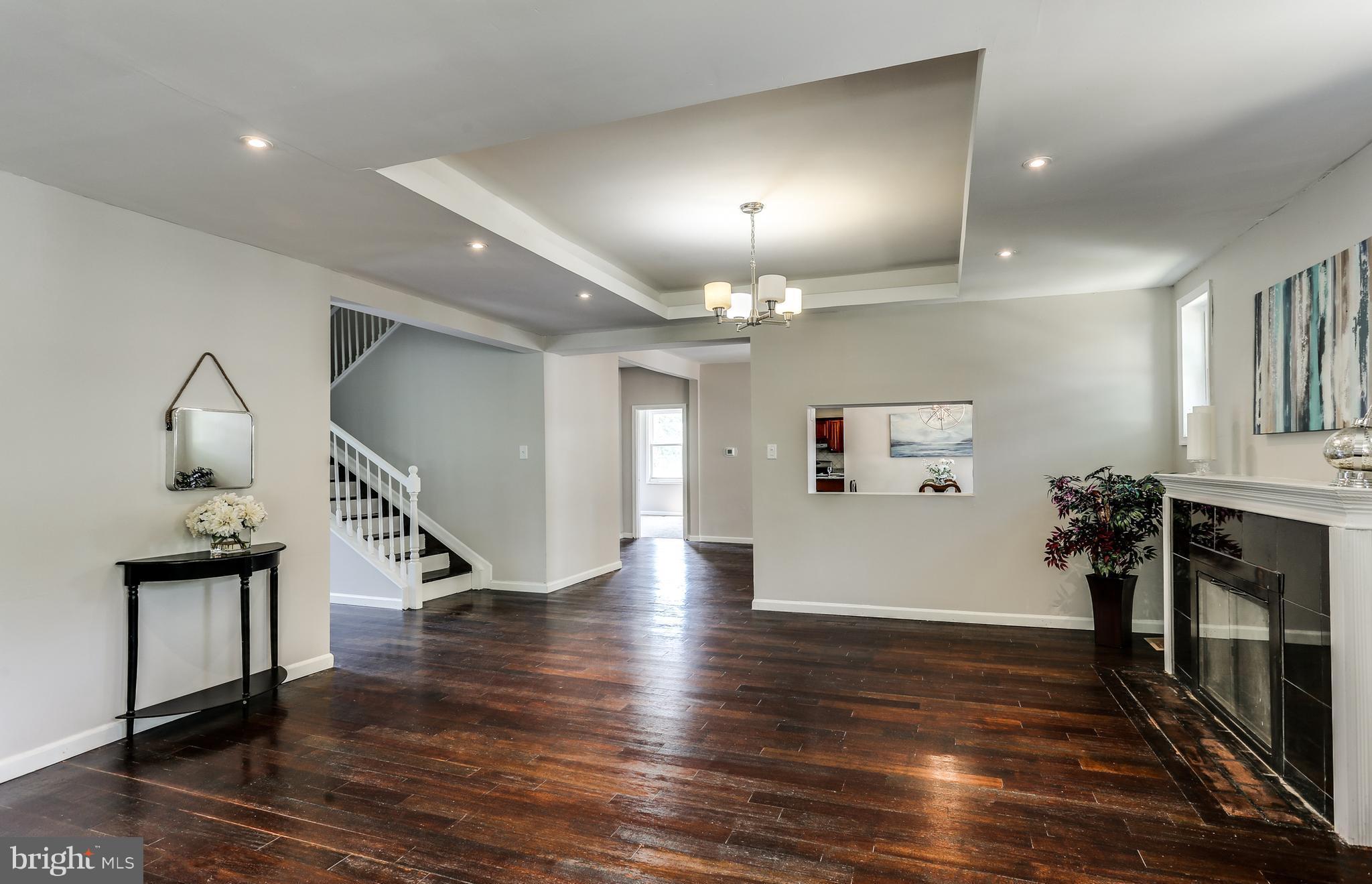 4504 Ritchie Highway Baltimore, MD 21225 - Photo 5 of 21 Living Room with Fireplace and Trey Ceiling