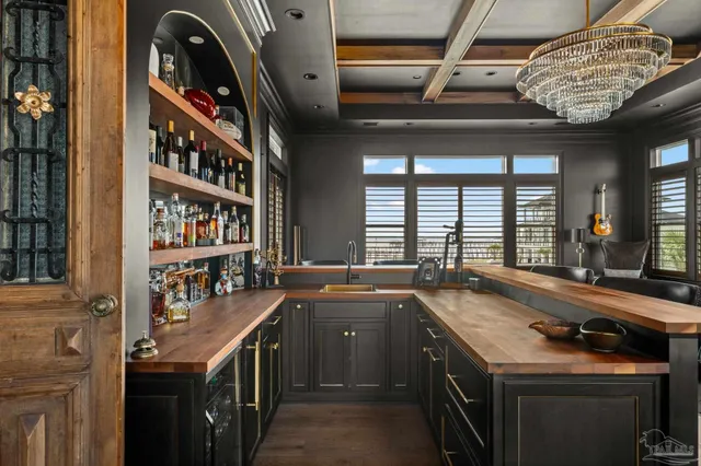 a bedroom with furniture and a large window