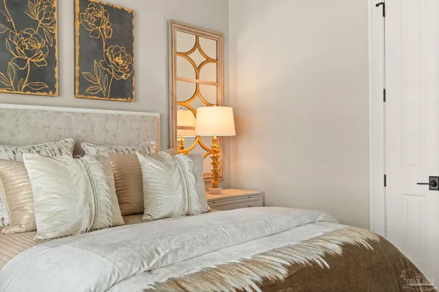 a bedroom with two beds and a window