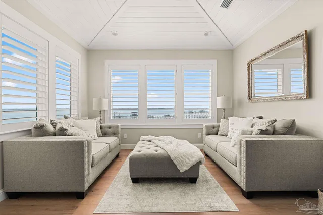 a living room with furniture fireplace and flat screen tv