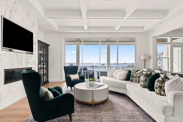 a living room with fireplace furniture and a flat screen tv