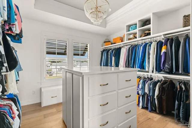 a view of a house with backyard porch and sitting area
