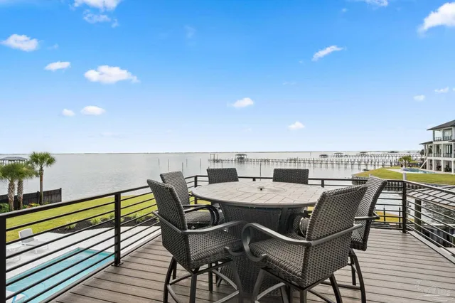 an aerial view of a swimming pool and outdoor seating