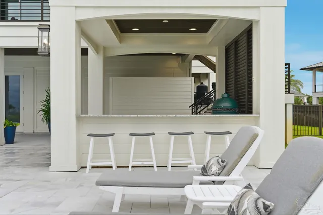 an aerial view of a house with a swimming pool