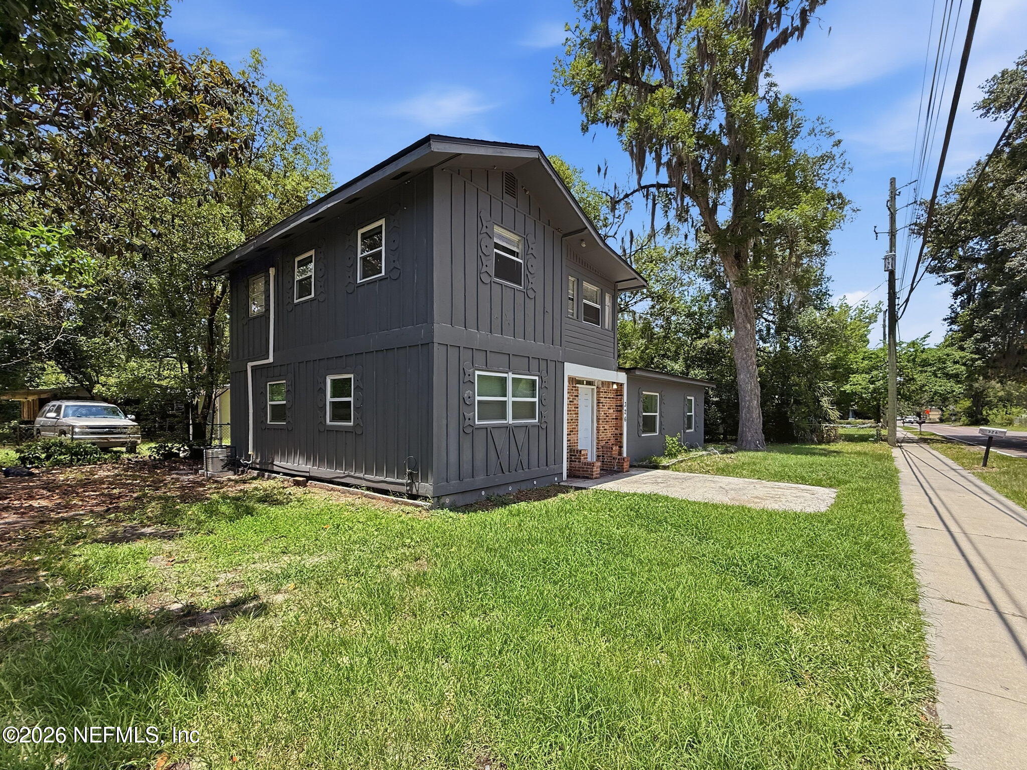 326 Cahoon Road South Jacksonville, FL 32220 - Photo 3 of 34 a view of an house with backyard and trees