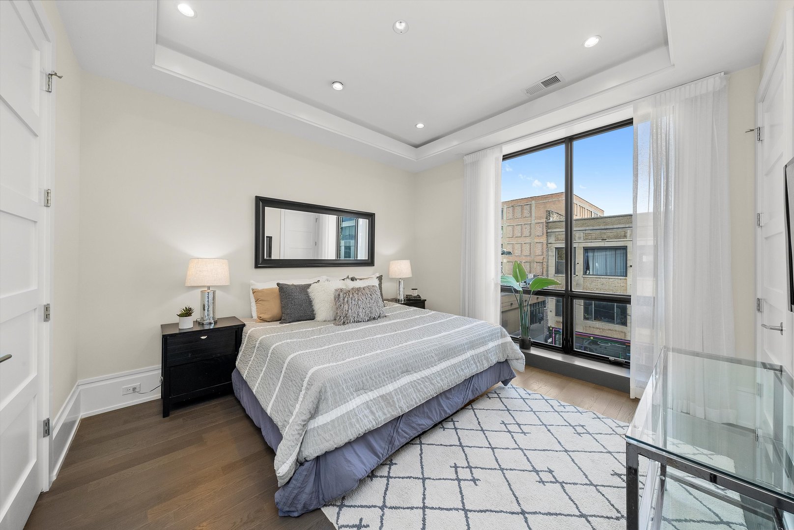 1258 North Milwaukee Avenue, Unit 3N Chicago, IL 60622 - Photo 17 of 36 a bedroom with a bed and a window