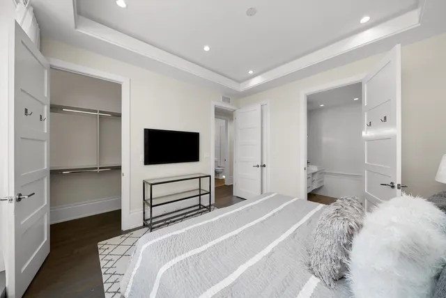 a bathroom with a double vanity sink a mirror and a shower