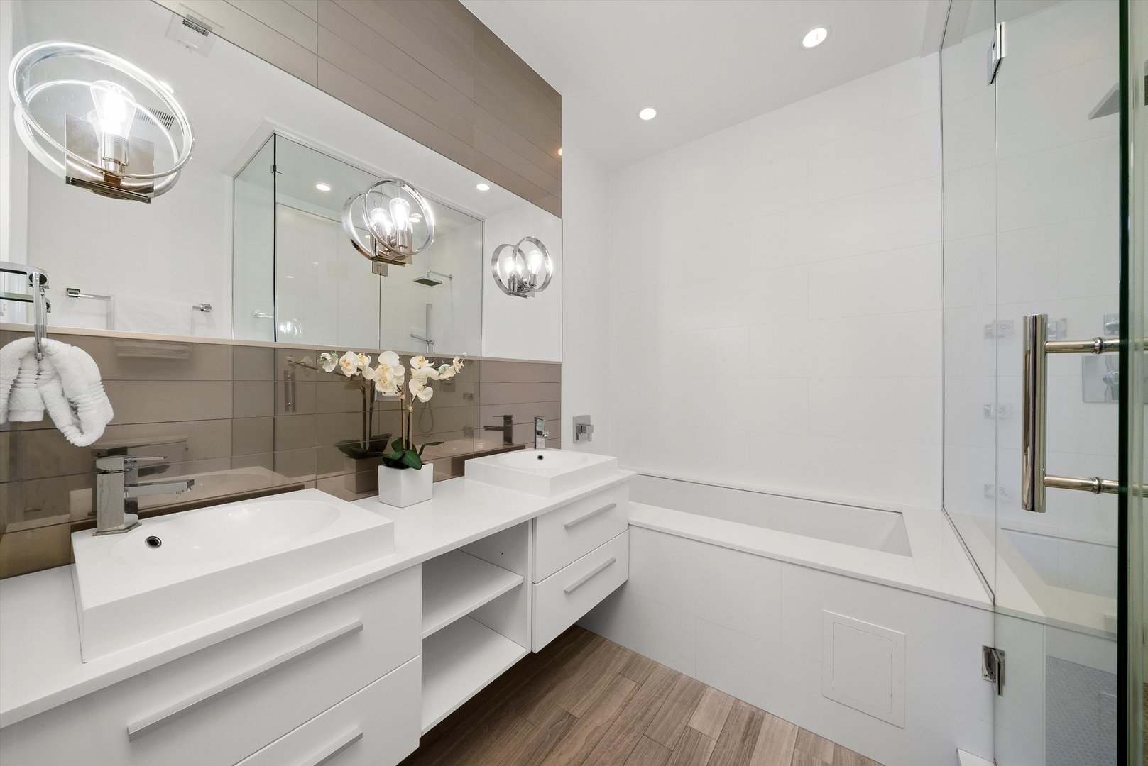 1258 North Milwaukee Avenue, Unit 3N Chicago, IL 60622 - Photo 20 of 36 a bathroom with a double vanity sink a mirror and a shower