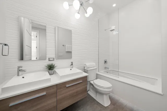 a bathroom with a toilet and a sink