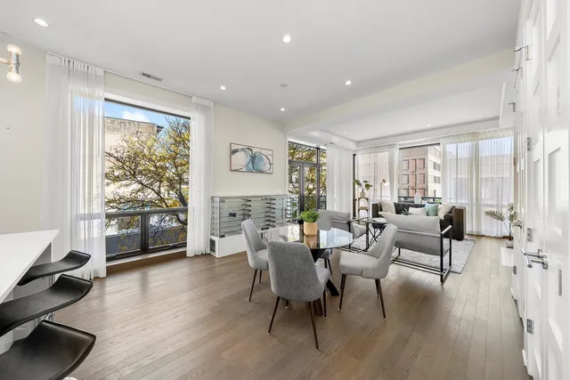 a living room with furniture or wooden floor and a rug