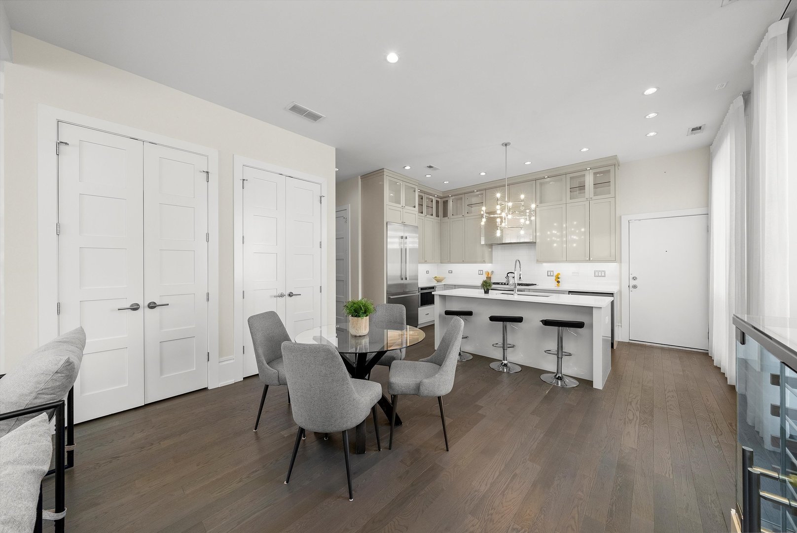 1258 North Milwaukee Avenue, Unit 3N Chicago, IL 60622 - Photo 7 of 36 a view of a dining room with furniture and wooden floor