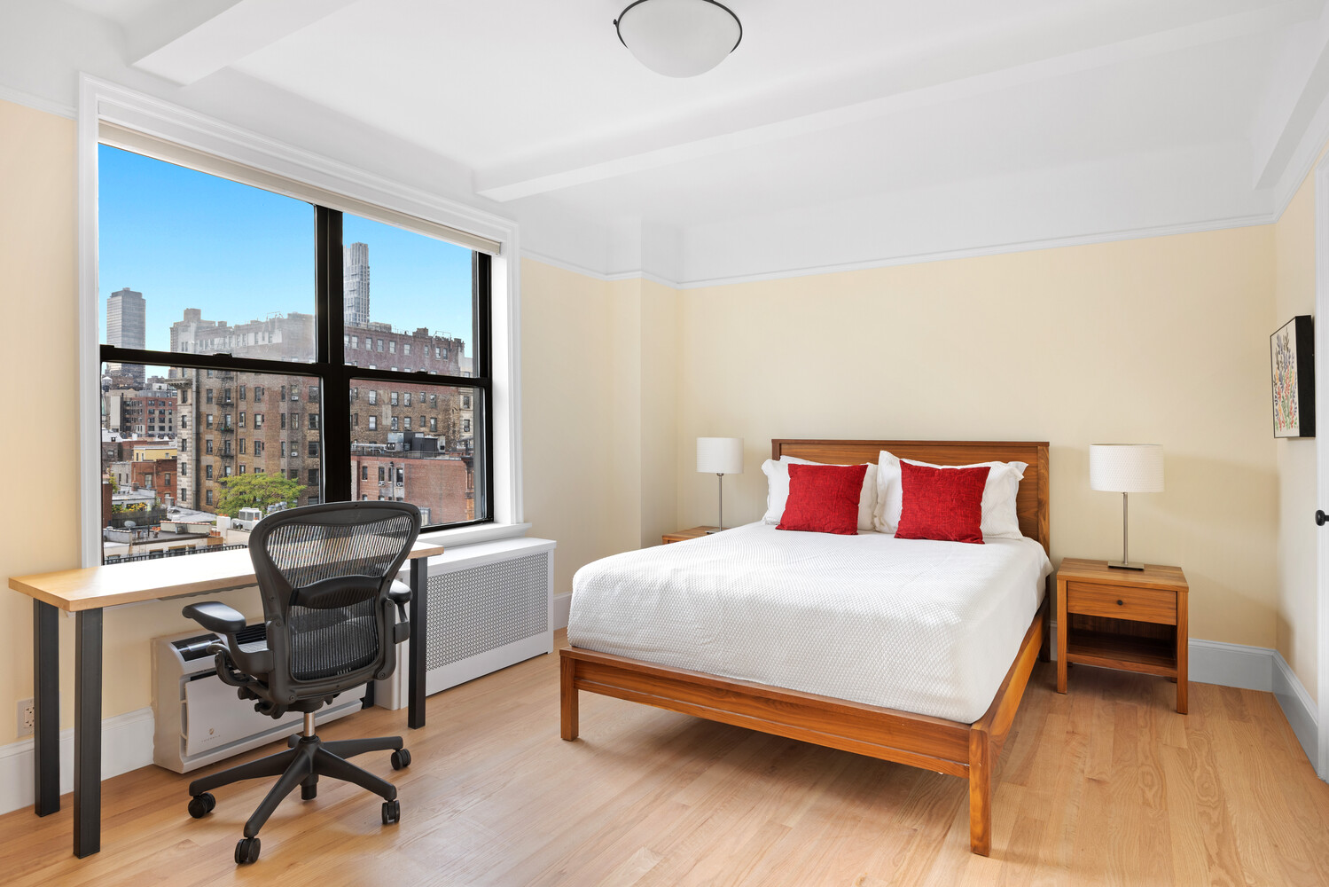 40 West 77th Street, Unit 10D Manhattan, NY 10024 - Photo 4 of 9 a bedroom with a bed and a table