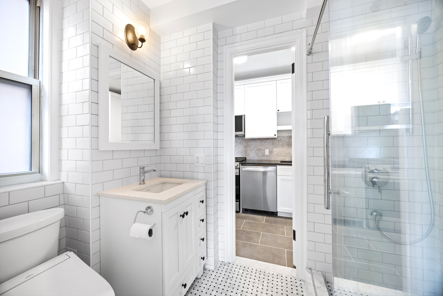 40 West 77th Street, Unit 10D Manhattan, NY 10024 - Photo 7 of 9 a bathroom with a sink a toilet and shower