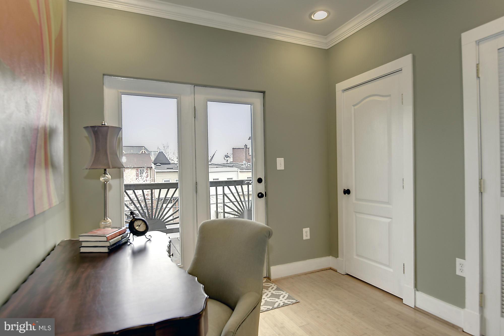 1126 Columbia Road Northwest, Unit 3 Washington, DC 20009 - Photo 17 of 23 a workspace with furniture and a window