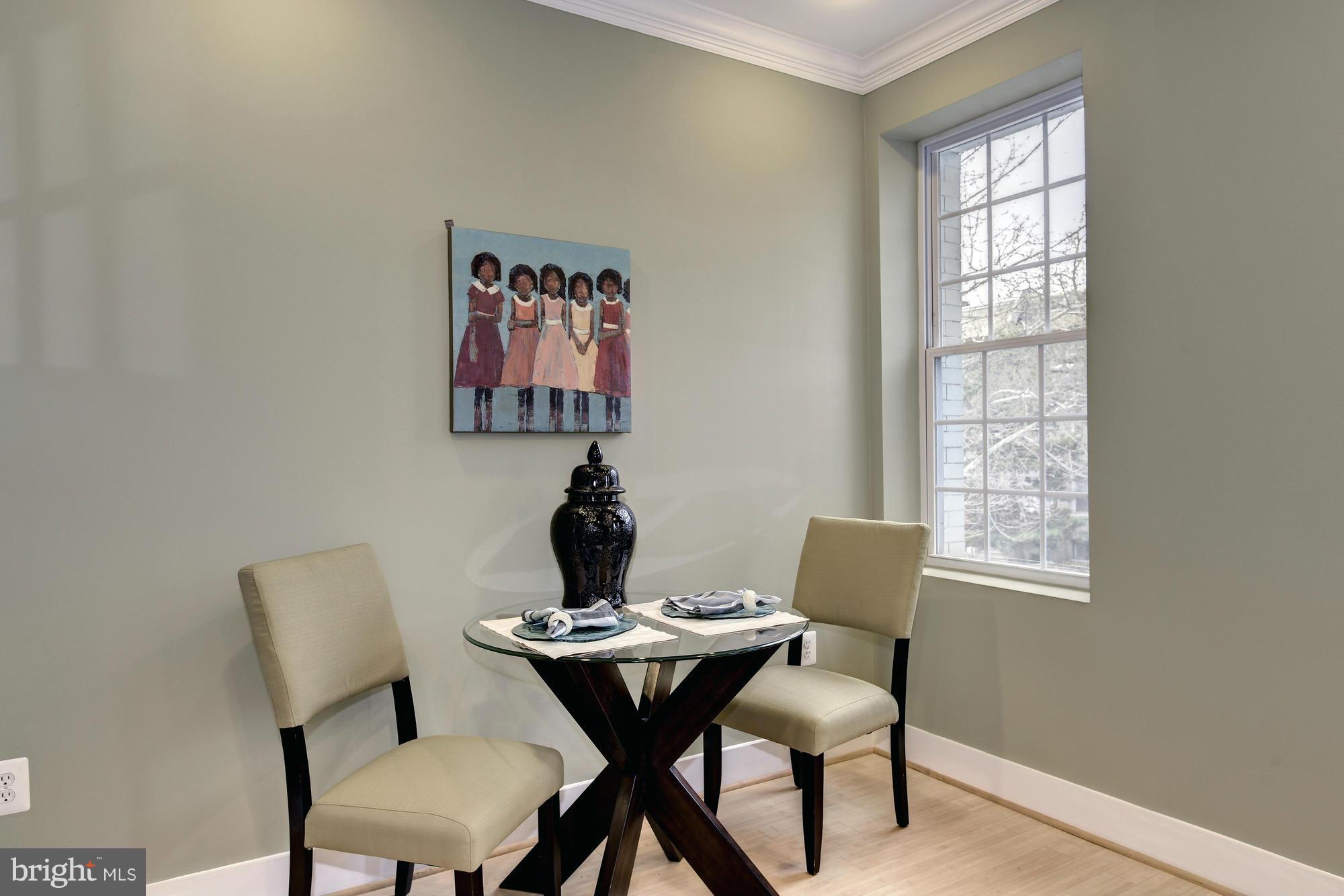 1126 Columbia Road Northwest, Unit 3 Washington, DC 20009 - Photo 6 of 23 a view of a dining room with furniture and window
