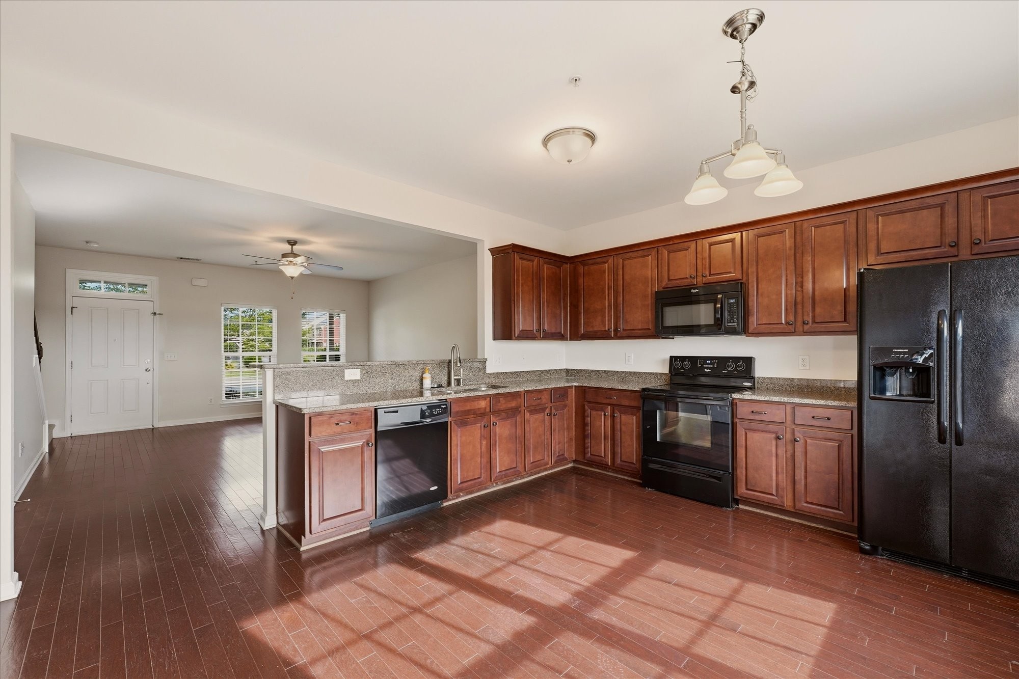 2050 Hemlock Drive Spring Hill, TN 37174 - Photo 10 of 48 a kitchen with stainless steel appliances granite countertop a refrigerator a stove top oven a sink dishwasher and wooden cabinets