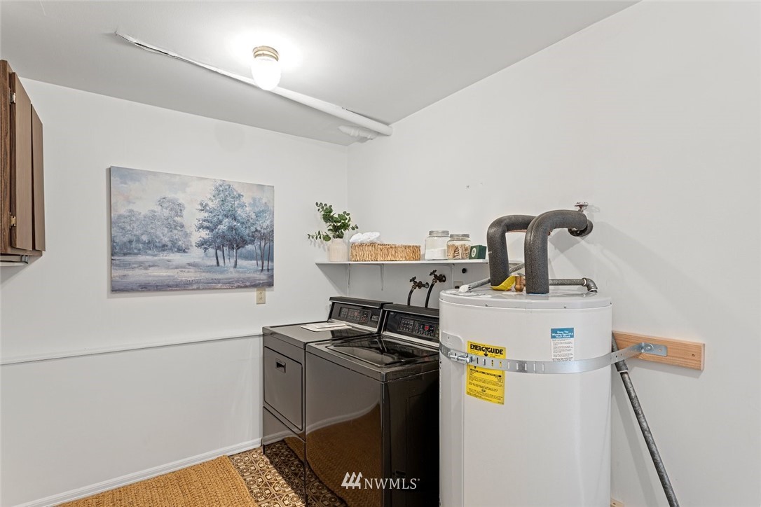 618 221st Street Southwest Bothell, WA 98021 - Photo 22 of 26 a kitchen with a refrigerator and a stove