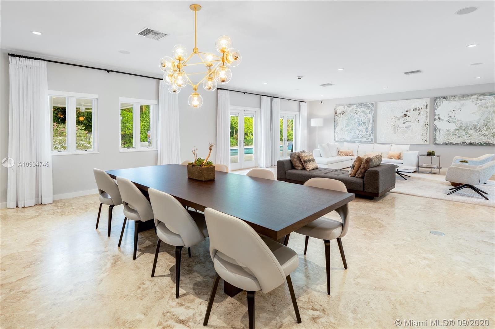 4301 Bay Point Road Miami, FL 33137 - Photo 11 of 33 a view of a dining room with furniture window and wooden floor