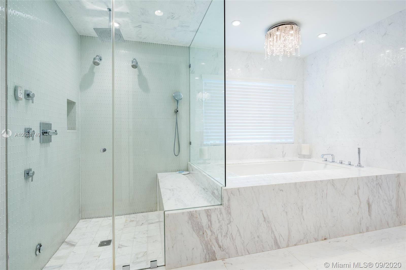 4301 Bay Point Road Miami, FL 33137 - Photo 18 of 33 a bathroom with a bathtub and a shower