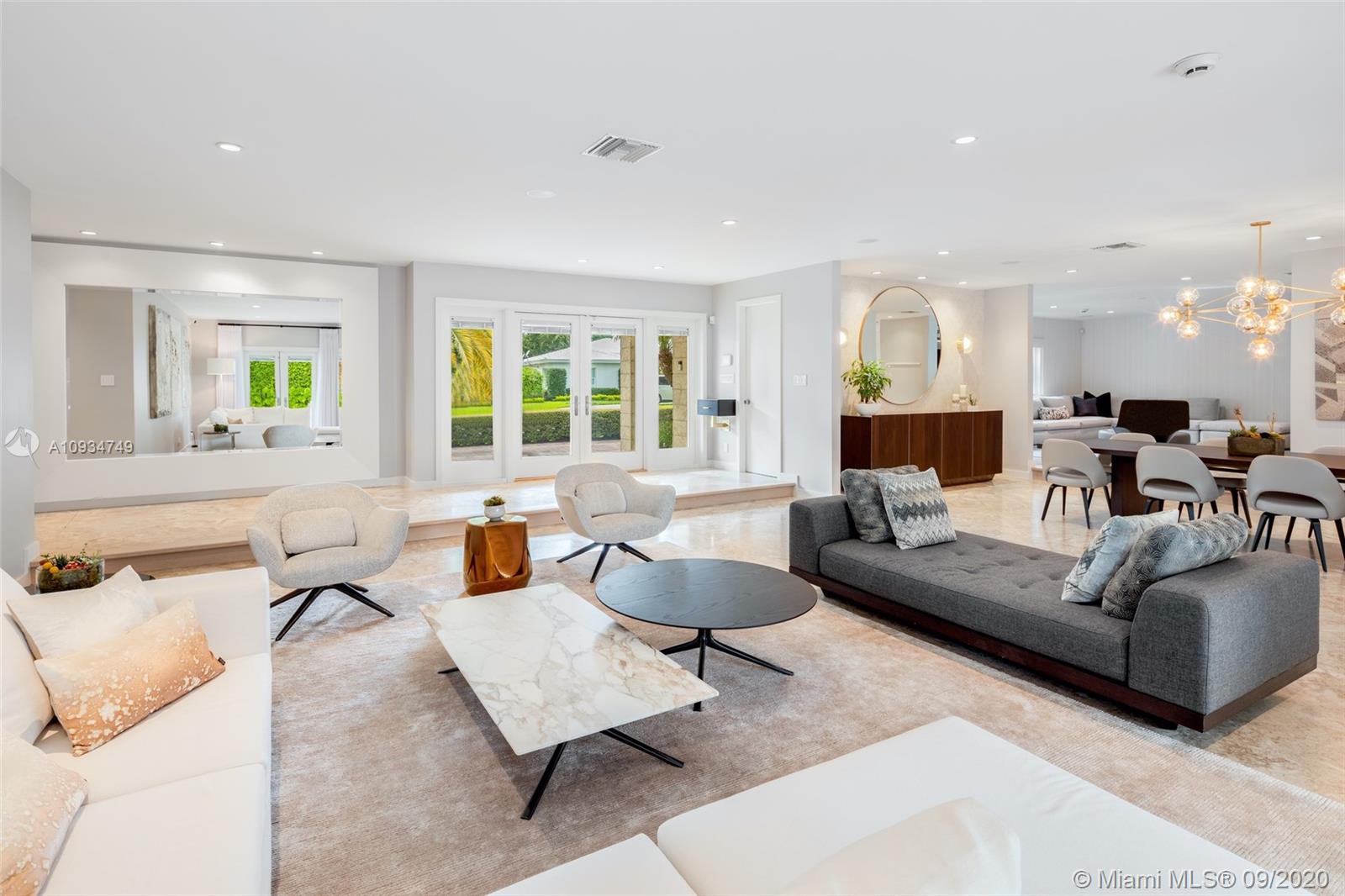 4301 Bay Point Road Miami, FL 33137 - Photo 2 of 33 a living room with furniture and a large window