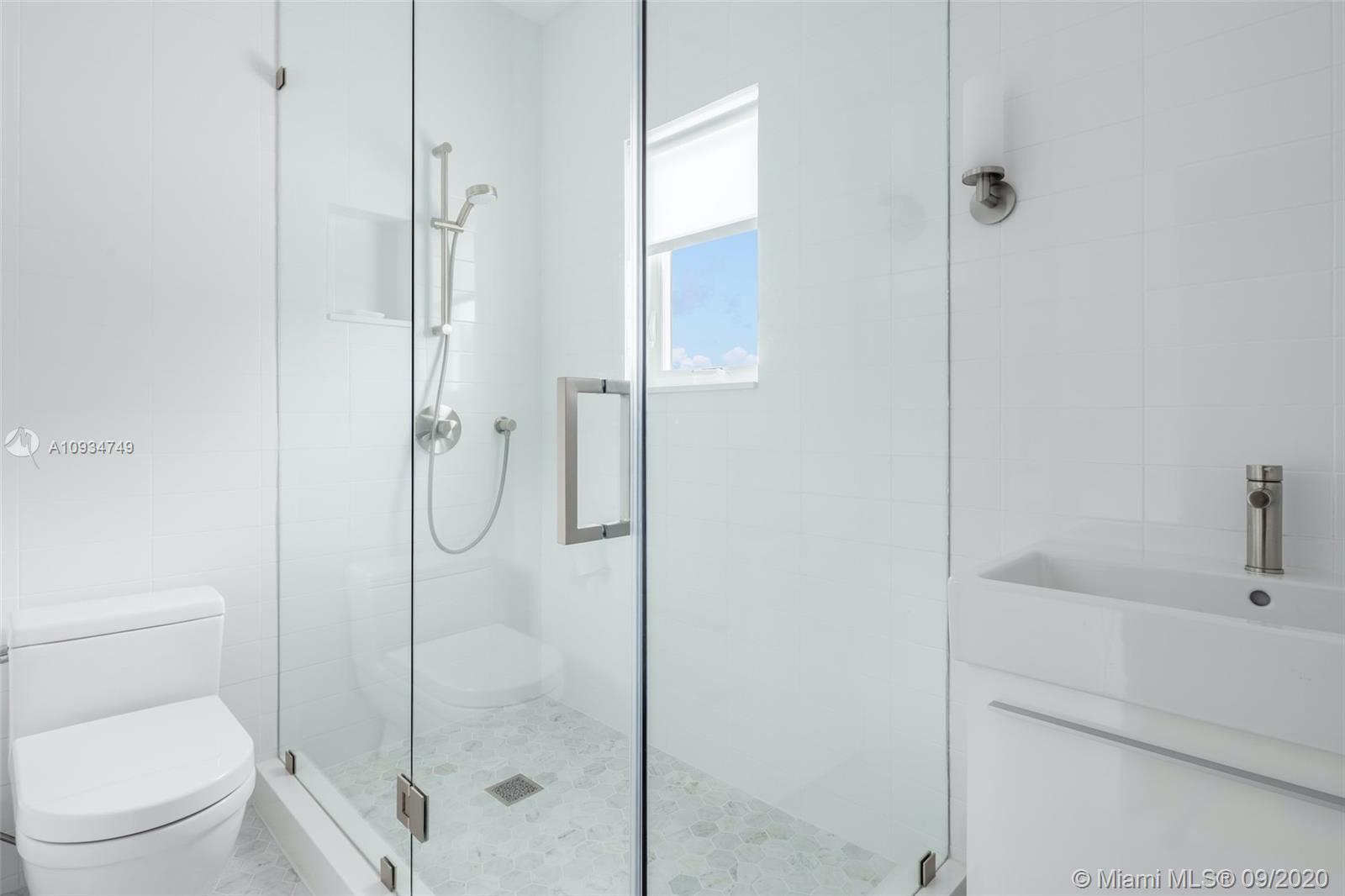 4301 Bay Point Road Miami, FL 33137 - Photo 23 of 33 a bathroom with a shower and a toilet