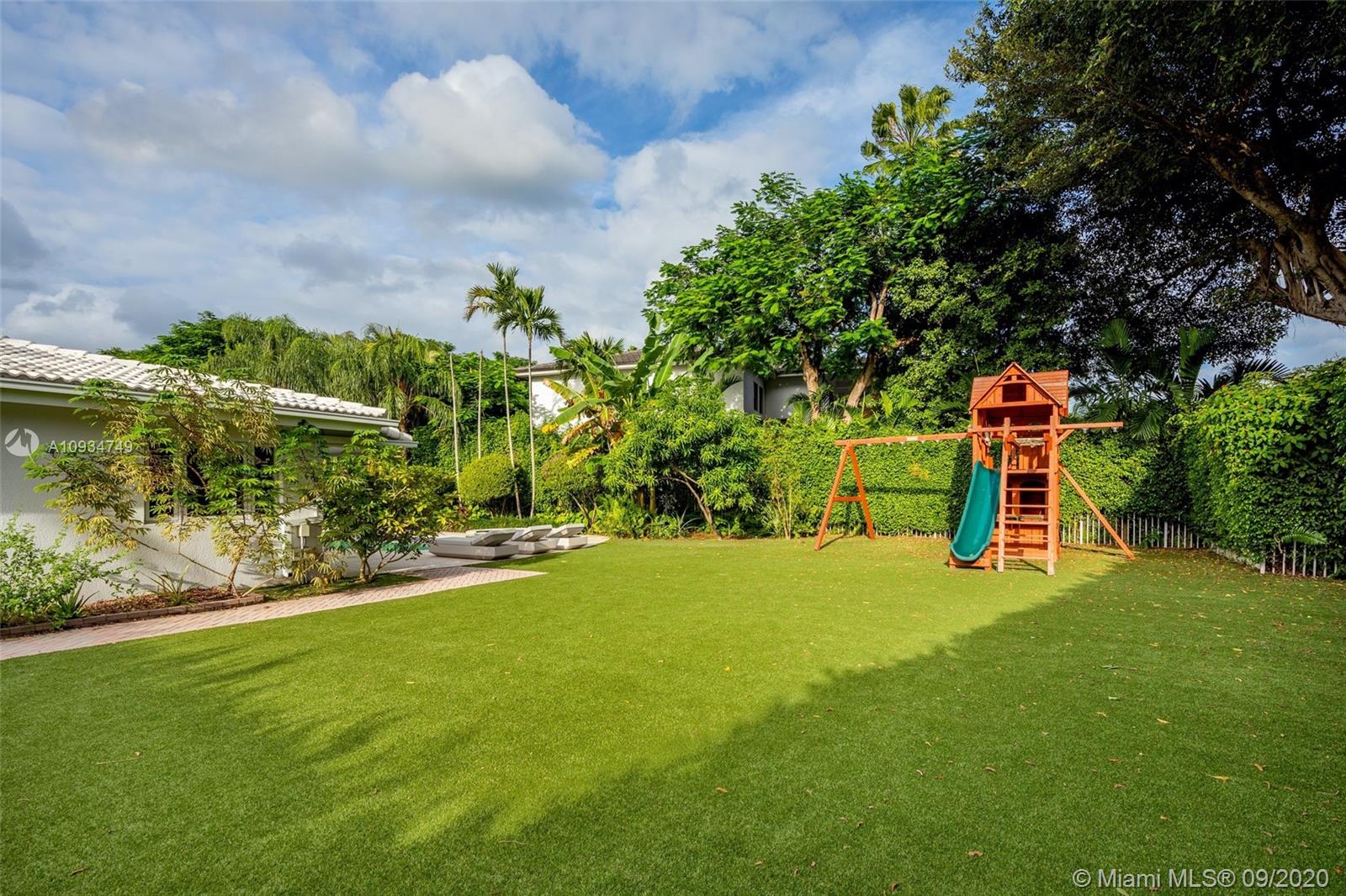 4301 Bay Point Road Miami, FL 33137 - Photo 29 of 33 a view of a ground with large trees