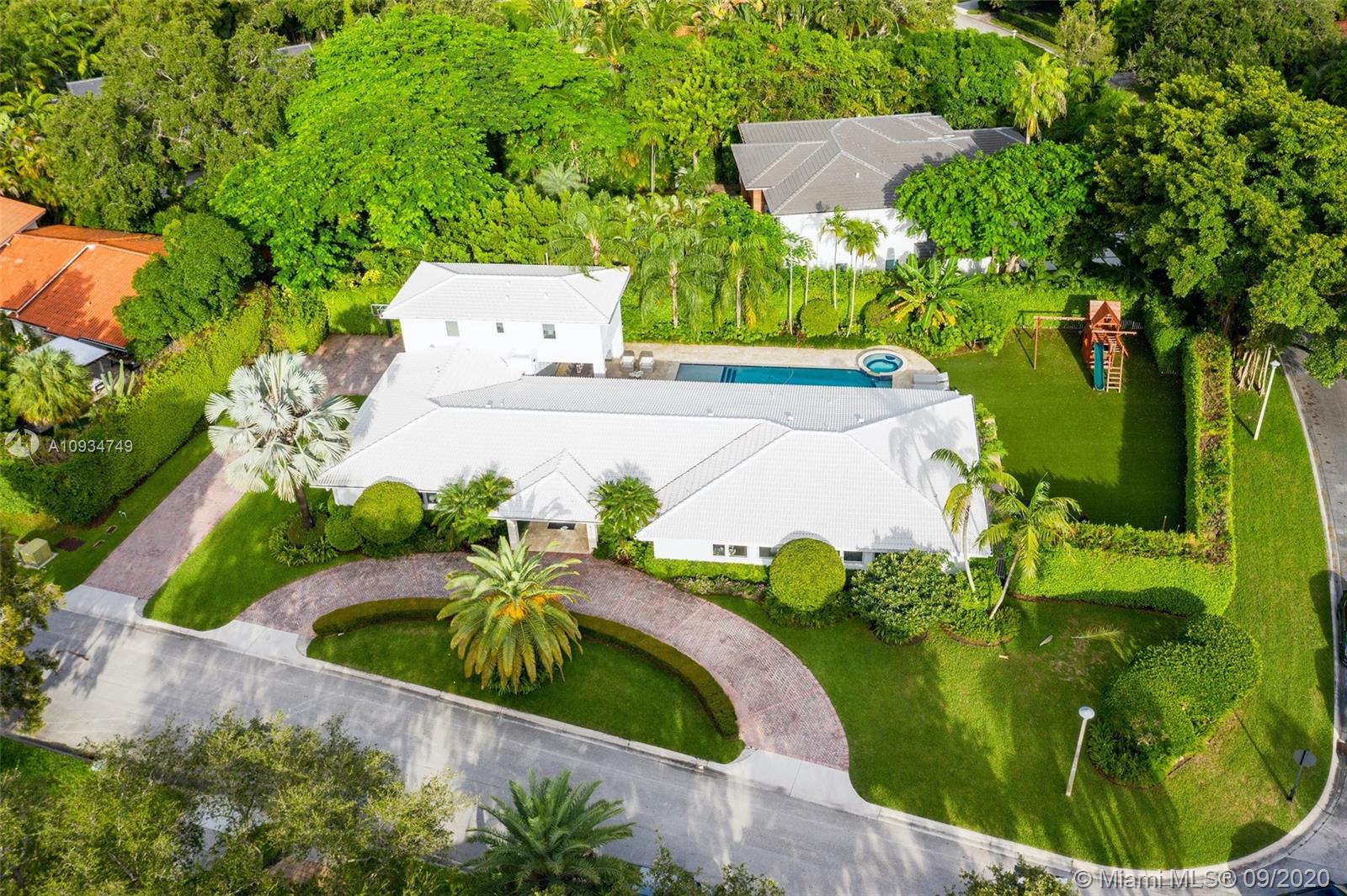 4301 Bay Point Road Miami, FL 33137 - Photo 3 of 33 an aerial view of a house having yard