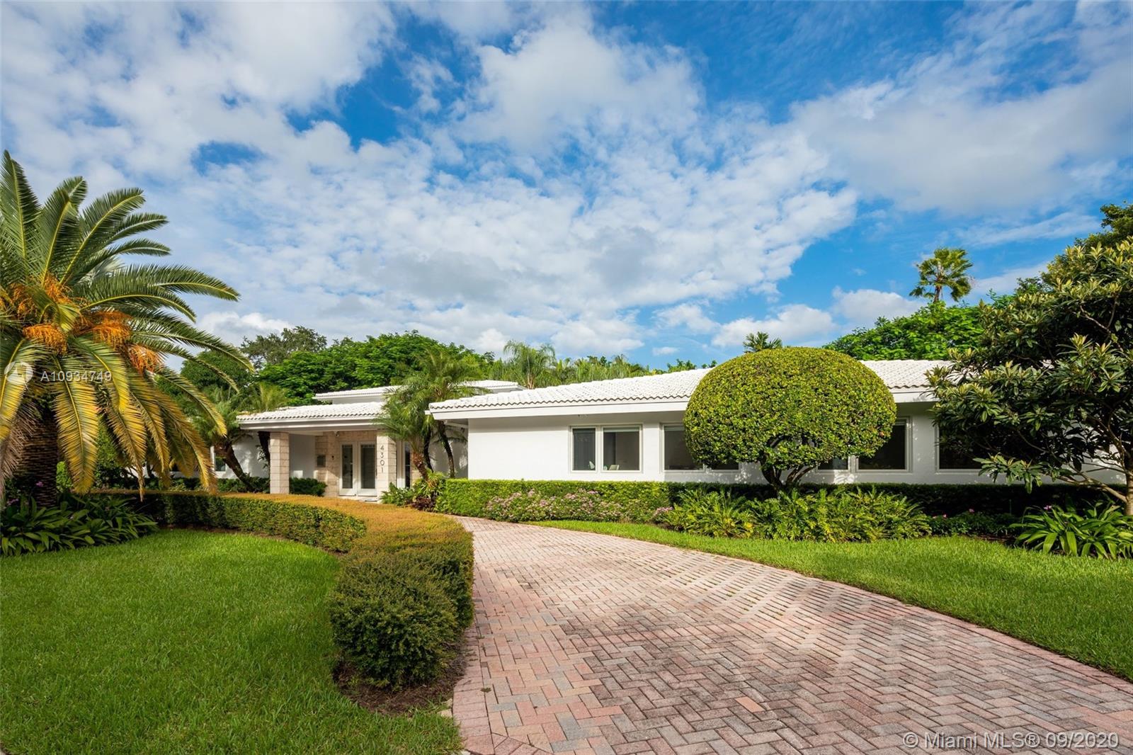 4301 Bay Point Road Miami, FL 33137 - Photo 5 of 33 a front view of a house with garden