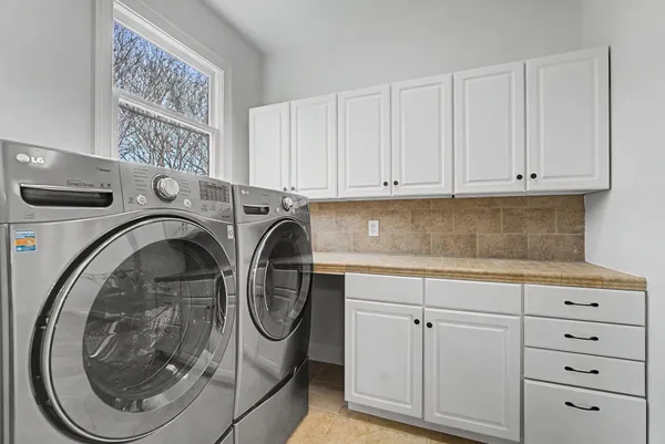 a utility room with dryer and washer