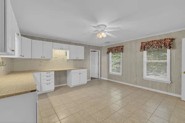 a view of a kitchen with electric appliances