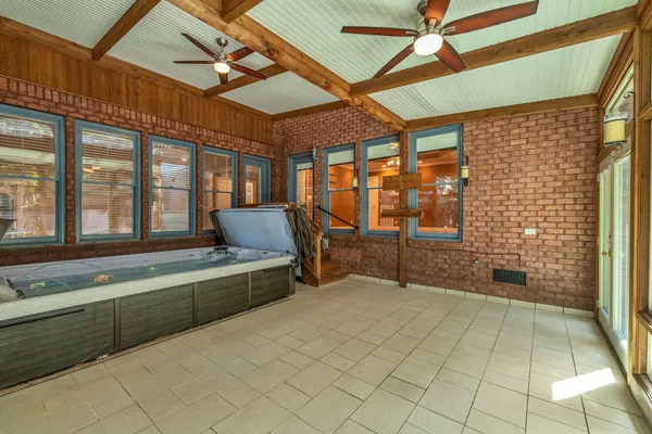 a spacious bathroom with a tub and shower