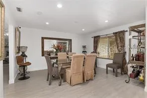 a view of a livingroom with furniture and a flat screen tv