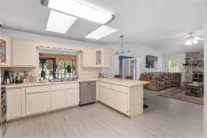 a kitchen with a sink stove and microwave