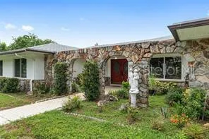 a aerial view of a house with a yard