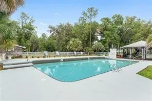 a view of a swimming pool with a patio