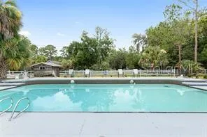 a view of a swimming pool with a patio