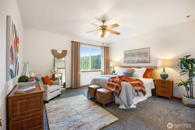 a bedroom with bed and window