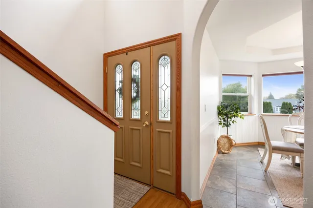 a view of a porch with chairs and entryway