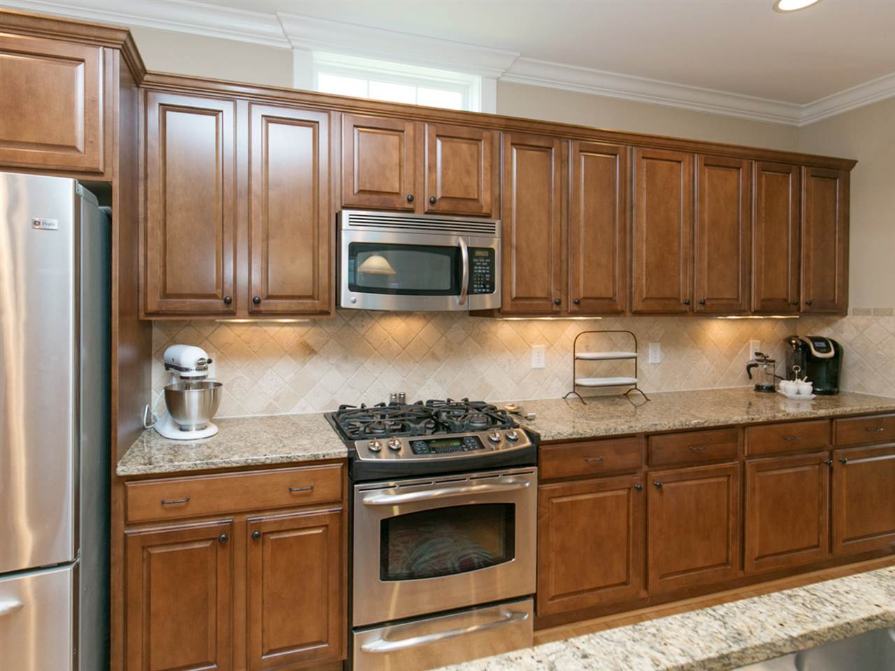 1348 Ileagnes Road Raleigh, NC 27603 - Photo 8 of 25 Stainless steel appliances, gas range, granite and custom cabinetry Kitchen