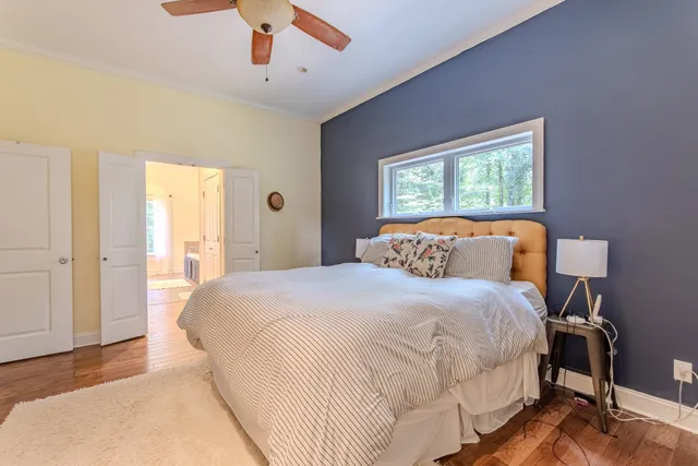 a bedroom with bed and window