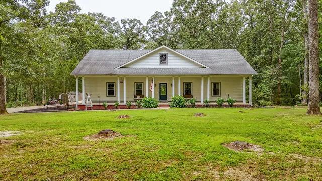 a front view of a house with having yard