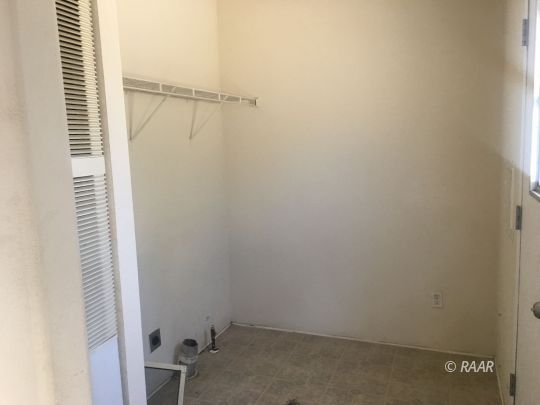 1409 Pinto Street Ridgecrest, CA 93555 - Photo 4 of 12 an empty room with a window
