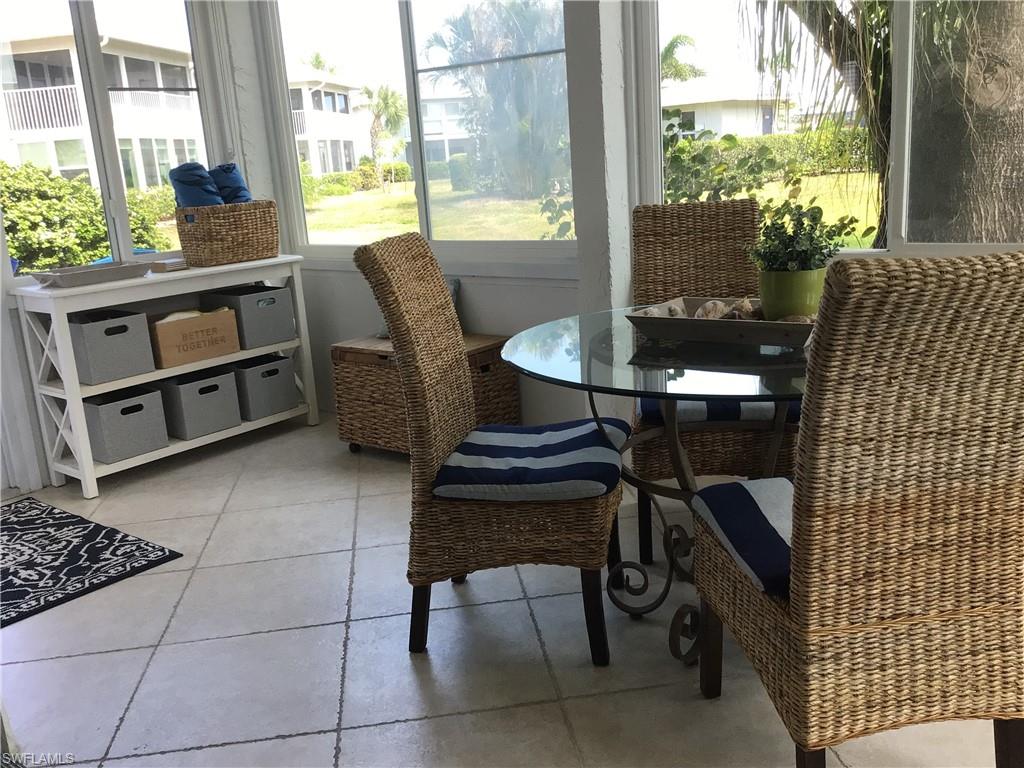 195 Peppermint Lane, Unit 881 Naples, FL 34112 - Photo 17 of 35 a view of a dining room with furniture window and outside view