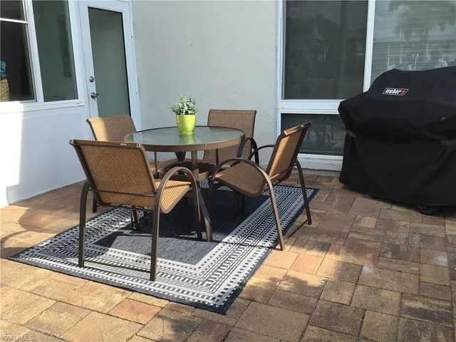 a living room with a couch and a large window